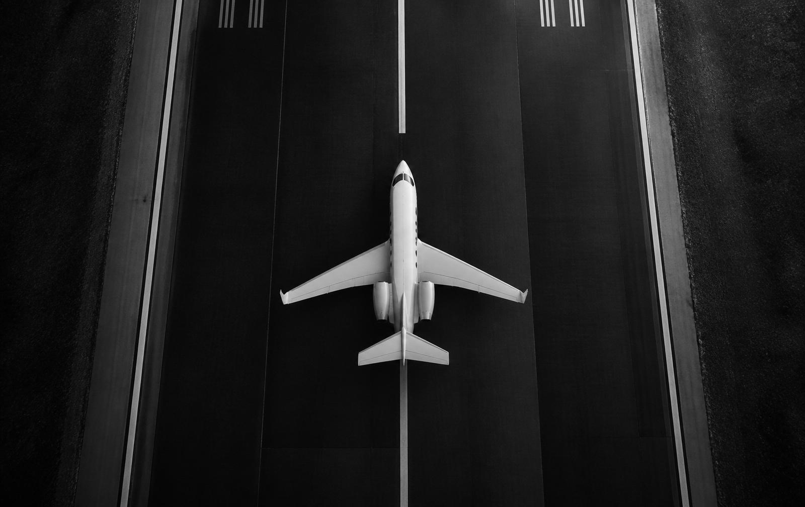 Aerial view of a private jet on a runway